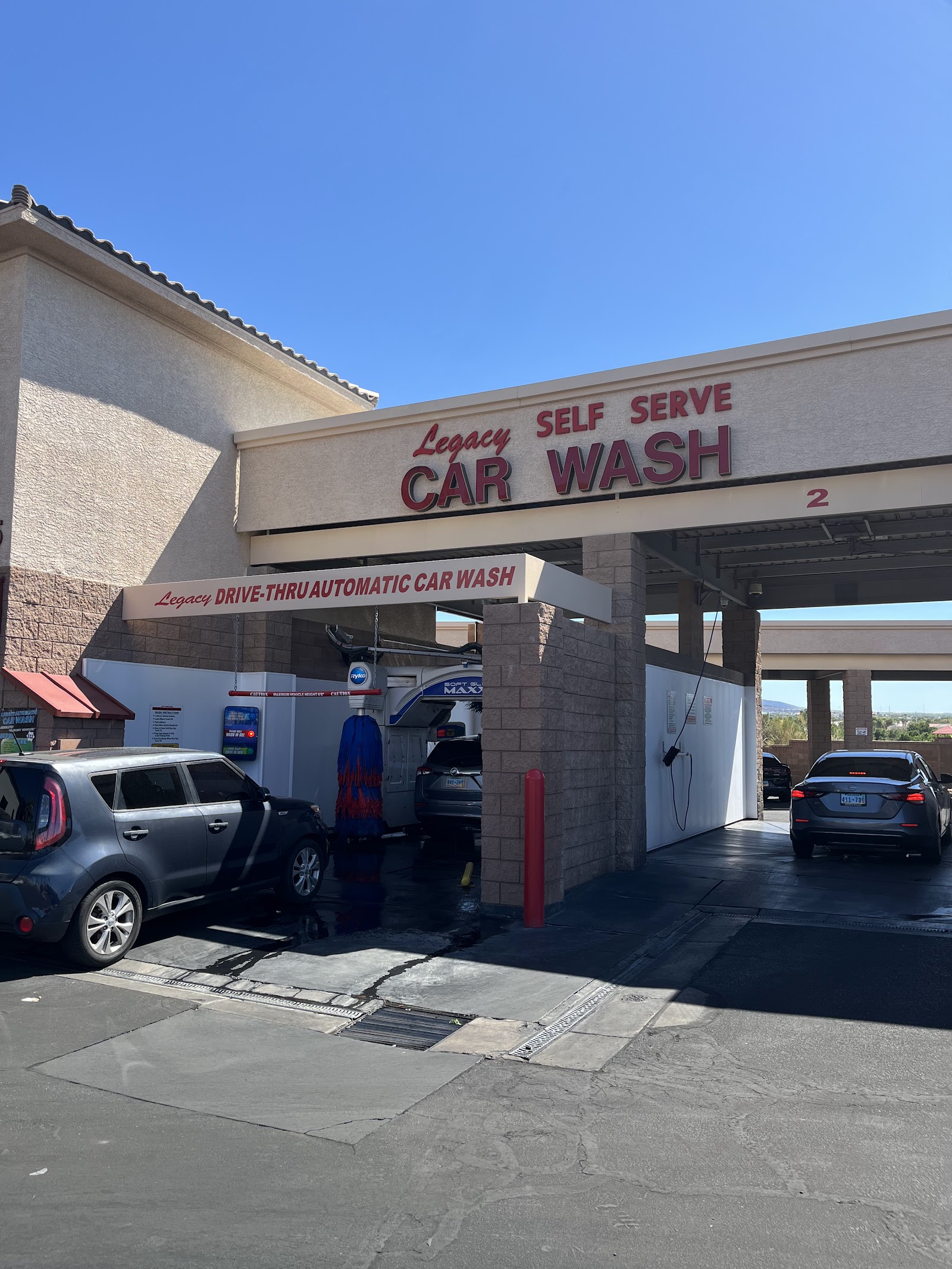 Legacy Self Serve Car Wash exterior with signage and drive-thru automatic bay